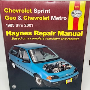 May include: A Haynes Repair Manual for Chevrolet Sprint, Geo, and Chevrolet Metro vehicles from 1985 to 2001. The cover features a blue car with its hood open, showcasing the engine. The manual includes essential information.