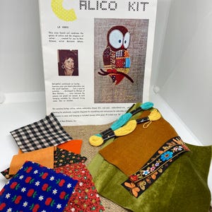May include: A calico kit for creating a patchwork owl with embroidery details. The kit includes fabric scraps in various patterns and colors, embroidery floss, and instructions. The finished size is 8 inches. The kit also includes a piece of burlap for the backing.