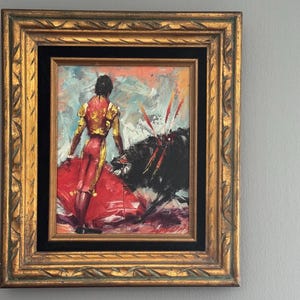 vintage 1960s matador with bull oil painting, framed Spanish wall art