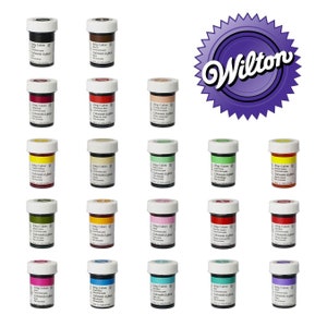 May include: Twenty-four bottles of Wilton Icing Colors in various colors, including red, blue, green, yellow, and orange. The bottles are labeled with the Wilton logo and the words "Icing Colors" and "Colorante da glace".