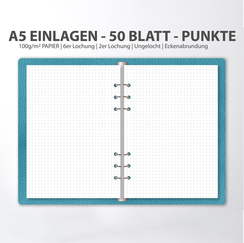 May include: A blue A5 notebook with a silver binding and dotted paper. The notebook has 50 sheets of 100gsm paper. The text on the cover reads "A5 EINLAGEN - 50 BLATT - PUNKTE 100g/m&sup2; PAPIER | 6er Lochung | 2er Lochung | Ungelocht | Eckenabrundung".