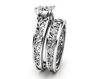 Set van 14 kt witgouden moissaniet verlovingsring: filigraan art-deco bruids
