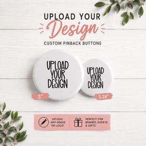 May include: Two white circular pinback buttons with black text reading UPLOAD YOUR DESIGN. The larger button is 3 inches in diameter, and the smaller button is 2.25 inches in diameter. The text UPLOAD YOUR DESIGN is also printed above the buttons.