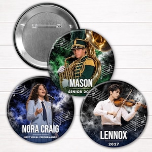 May include: Three circular pin-back buttons featuring musical themes. One shows a marching band member with a tuba, one a vocalist in a light blue suit, and one a violinist. Each button includes a name, musical notes, and a dark background.