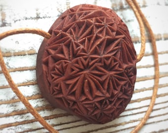 Avocado pit necklace with Crazy Lace chip carved geometrical design | Hand carved wearable art | Extremely intricate carving