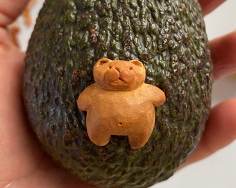 Hand carved avocado pit tiny teddy bear. miniature figurine. Totem animal. Mini sculpture. Amulet.