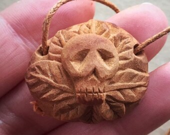 Carved avocado pit necklace | Sugar skull | Wearable art |