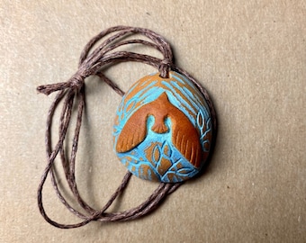 Carved avocado pit necklace. Blue bird. Bird pendant. Natural jewelry . Spirit animal pendant necklace.