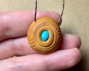 Carved svocado pit necklace with turquoise. Nature inspired jewelry.