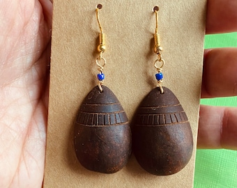 Carved avocado pit earrings. Handmade dangle earrings. Natural jewelry.