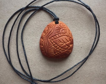 Carved avocado pit necklace with wooden bead | Henna art inspired design|