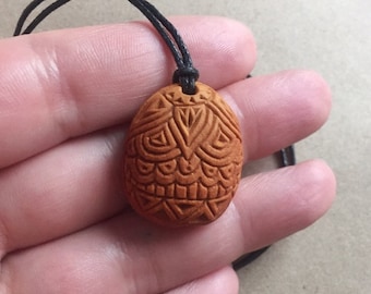 Carved avocado pit necklace with wooden bead | Henna art inspired design|