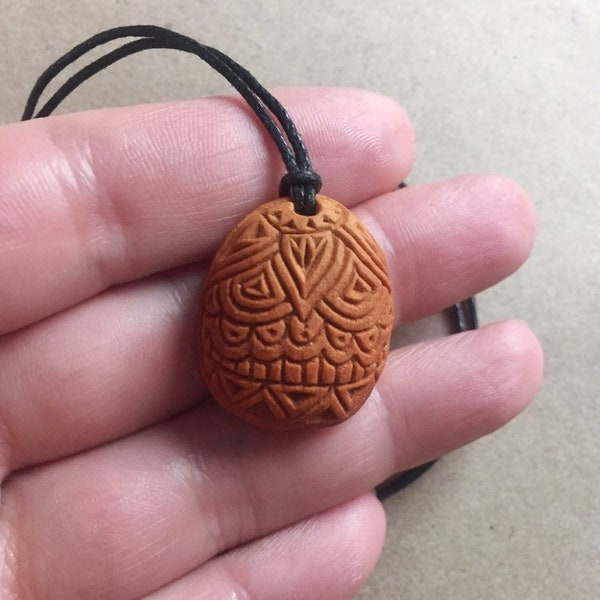 Carved avocado pit necklace with wooden bead | Henna art inspired design|