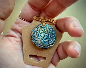 Carved avocado pit necklace with blue accents | Chip carving | Gift for avocado lover | Abstract design |