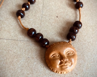 Hand carved avocado pit full moon choker necklace  18 inches.  Moon face. Celestial jewelry.