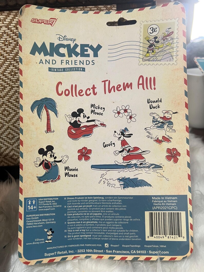 May include: Vintage Disney Mickey and Friends collectible packaging. The back of the package features illustrations of Mickey Mouse, Minnie Mouse, Donald Duck, and Goofy surfing. The packaging has a vintage aesthetic with a postage stamp design.
