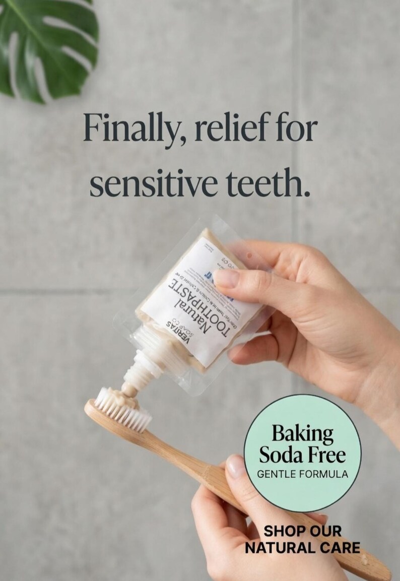 May include: A tube of Veritas Natural Toothpaste being squeezed onto a bamboo toothbrush. The image includes text that reads "Finally, relief for sensitive teeth." and "Baking Soda Free, Gentle Formula."
