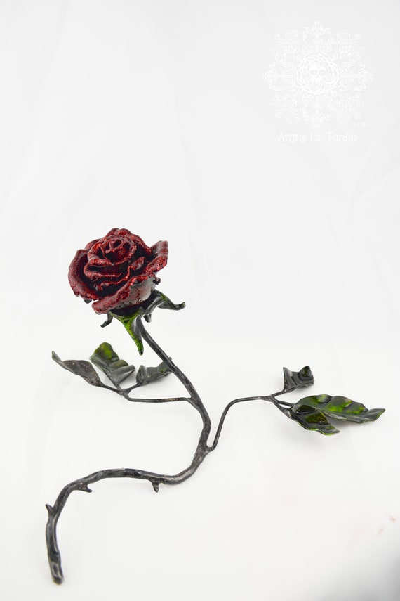 Sculpture of a Rose in metal in memory of "