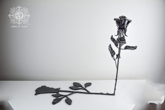 Metal sculpture of a Rose (the Shadow and its muse)