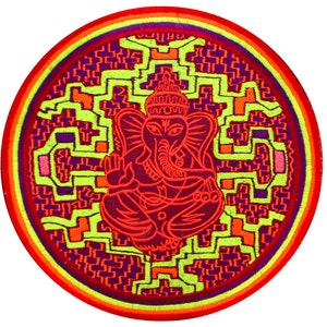 May include: Circular embroidered patch featuring a red depiction of the Hindu deity Ganesha, surrounded by a geometric pattern in neon green, purple, and orange. The patch has a rainbow-colored border and is set against a white background.