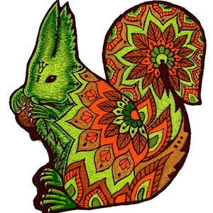 May include: Embroidered patch of a green squirrel holding a nut. The squirrel's body is decorated with a mandala design in orange, brown, and green. The patch has a detailed, textured appearance.
