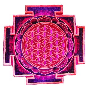 May include: Embroidered patch featuring a geometric design in shades of pink, magenta, and purple. The central circle showcases a flower of life pattern, surrounded by a lotus flower design. The patch has a square shape with a cross-like design.