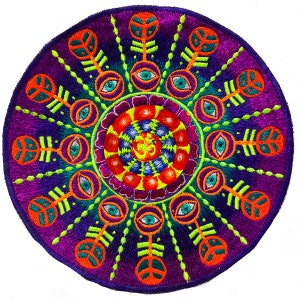 May include: Embroidered circular patch with a vibrant mandala design. The patch features a deep purple background with concentric circles of orange, green, and blue detailing. The center has a spiral pattern with an Om symbol.