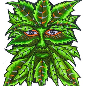 May include: Embroidered patch depicting a Green Man face made of green leaves. The face has orange-rimmed eyes, a small nose, and a defined mouth. The leaves have white and orange accents, with a black outline.