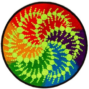 May include: Circular embroidered patch with a rainbow gradient background. The patch features a spiral design of lime green circles and connecting lines. The patch has a black border and is set against a white background.