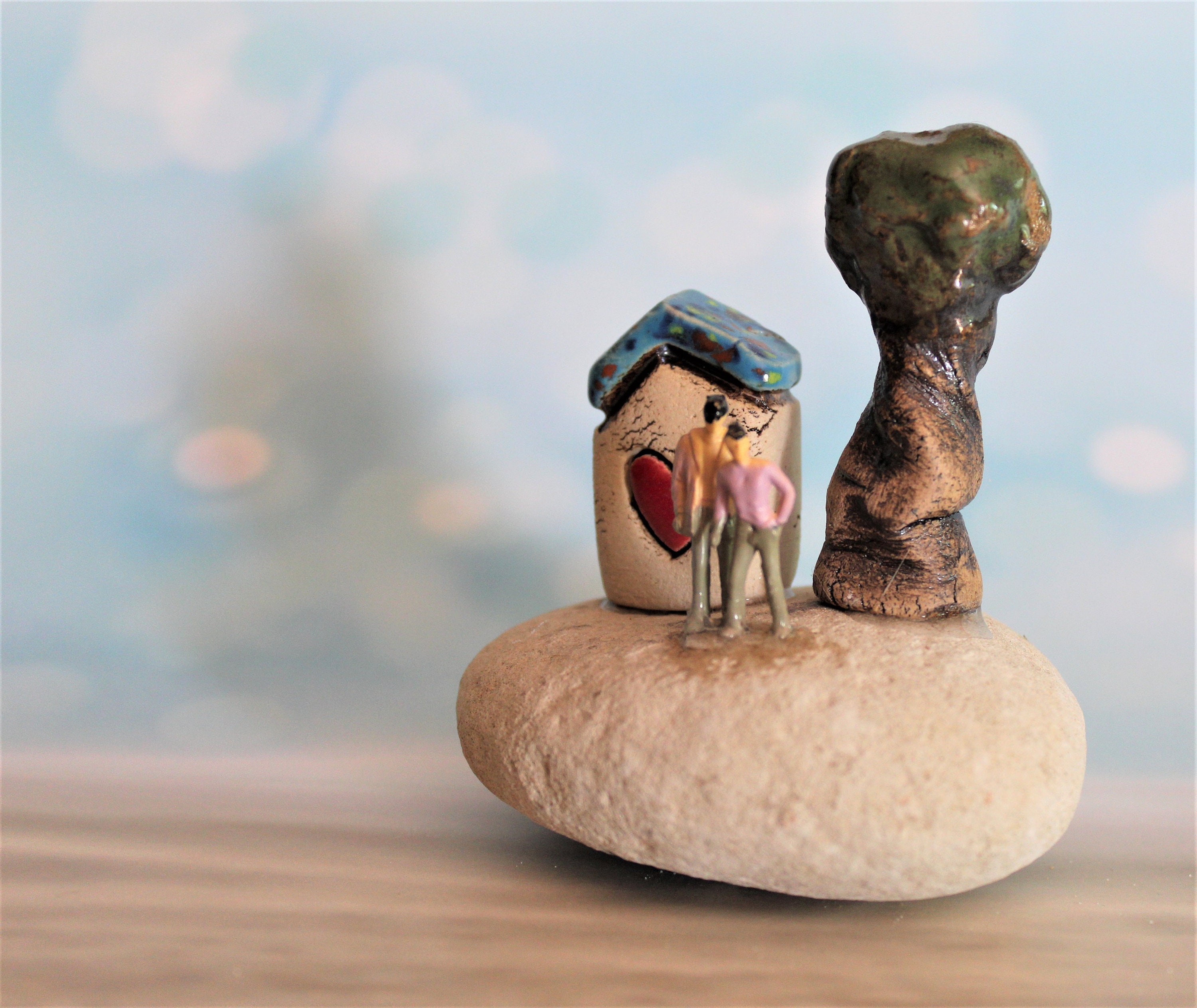 Small Ceramic Sculpture of a Brown Clay House With Human Face, an Antenna  and a Tree Beside It on a Clay Hill, Art Object 