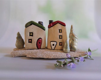 Home & Living art object, Ceramic sculpture of two clay houses and three trees on a Mediterranean beach stone