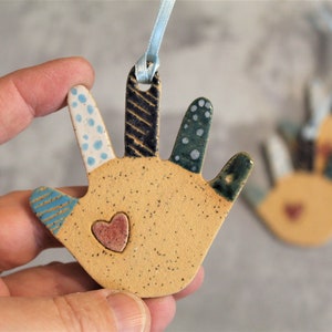 Small colorful ceramic Hamsa (Hand of Fatima) wall decor and good luck charm