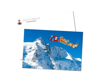 Funny Postcard Christmas Santa Claus over Mountain Father Christmas Cute Dog Airedale Welsh Lakeland Fox Terrier - 10 x 15 cm by Hallo Molly