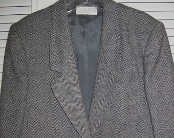 May include: A gray herringbone blazer with a single button closure and a pocket on each side. The label on the inside reads "Classics by Halston".