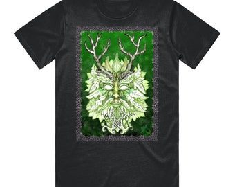 May include: Dark gray t-shirt featuring a detailed illustration of the Green Man. The artwork depicts a face composed of leaves, with antlers and a leafy beard, set against a green background within a decorative border.