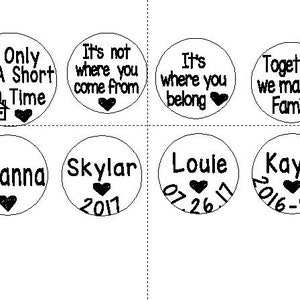 May include: Eight round, white, ceramic ornaments with black text and heart designs. The ornaments feature phrases like "If Only For A Short Time", "It's Not Where You Come From", "It's Where You Belong", "Together We Make A Family", "Brianna", "Skylar 2017", "Loule 07.26.17", and "Kayla 2016-2018".