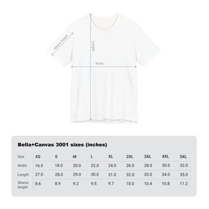 May include: A white t-shirt with measurements for width, length, and sleeve length. The image includes a size chart for Bella+Canvas 3001 t-shirts, showing sizes XS to 5XL, with measurements in inches.