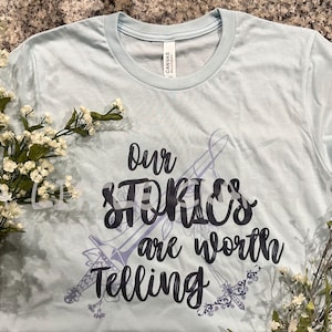 Our Stories are Worth Telling Valkyrie A Court of Silver Flames Inspired Bella + Canvas Officially Licensed T-shirt