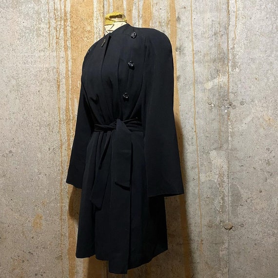 1930s early 40s black princess coat with deco butt