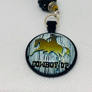 COWBOY RIDING HORSE (Black & Gold) Car Accessories Rear View Mirror Car Charm, Cowboy Car Charm, Cowboys, Rodeo, Cowboy Up Car Charm