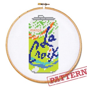 May include: Cross-stitch pattern of a La Croix sparkling water can in a wooden embroidery hoop. The can is yellow and green with the words "La Croix" and "Mango" on it.