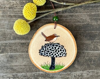 Carolina wren on old man of the woods mushroom wood slice ornament. Handmade by Forage Workshop