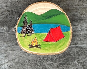 Lakeside camping scene magnet. Rustic wood burned and painted wood slice with campfire, tent, trees, mountains, moon. PREORDER