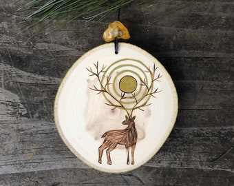 Happy Winter Solstice ornament or wall hanging. Wood burned deer w/golden sun in the branches/antlers. Handmade by Forage Workshop PREORDER