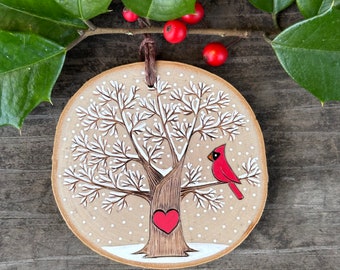 Snowy, winter tree with red cardinal and heart. Custom made, personalized wood slice ornament. Handmade by Forage Workshop PREORDER