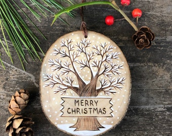 Snowy winter tree with Merry Christmas sign. Wood burned and painted Christmas ornament. Handmade by Forage Workshop PREORDER