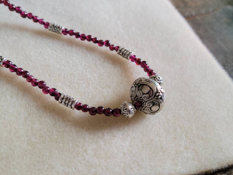 Garnet and silver princess length beaded necklace 17.75 inches.