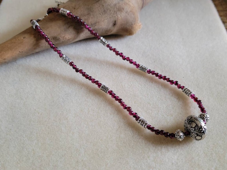 Garnet and silver princess length beaded necklace 17.75 inches.