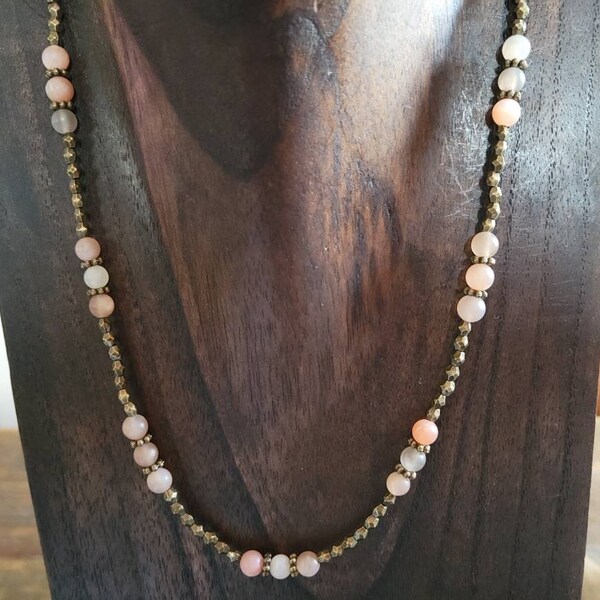 Mixed moonstone and antique brass polygons beaded matinee length necklace. 20 inches.