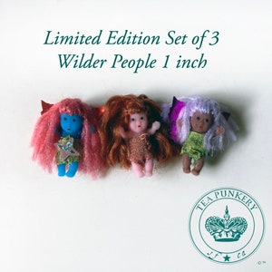 May include: A set of three Wilder People dolls, each approximately 1 inch tall. The dolls have different skin tones, hair colors, and outfits. The text "Limited Edition Set of 3 Wilder People 1 inch" is above the dolls.